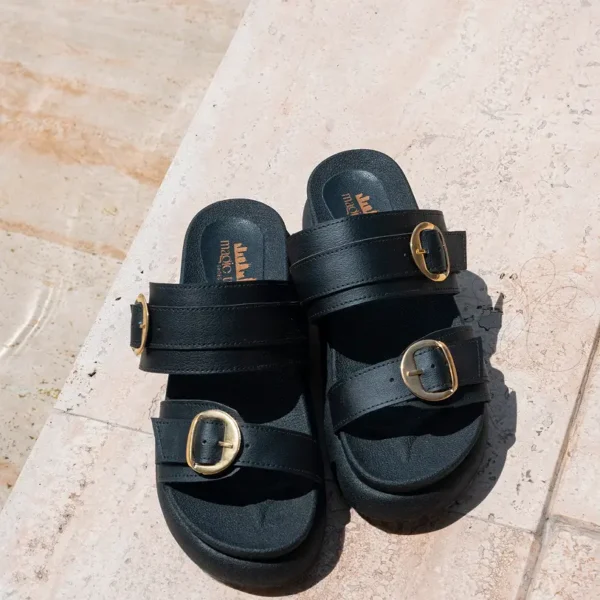 Black sandals with gold buckles